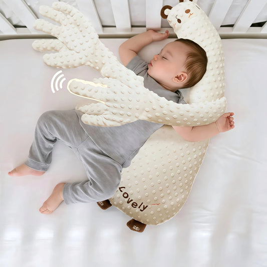 Moihug - White Bear Parent-Child Sleep Aid Pillow: A top-down view of an infant, wearing grey pants and a t-shirt, sleeping soundly on their side in a crib, hugging the cream-colored, granule-textured White Bear plush body pillow. The bear's long arms are wrapped around the baby, providing a secure feeling to warm your heart. This Therapeutic plush toy acts as a sleep aid device to How to help your baby fall asleep quickly, Soothe your negative emotions, and effectively Reduce the difficulties of mothers