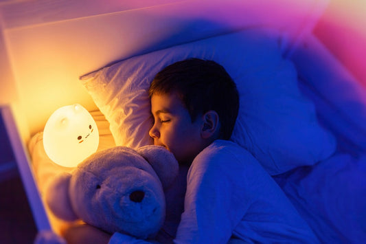 Cozy children's bedroom featuring warm lighting and soft bedding, an example of an environment that supports consistent bedtime routines