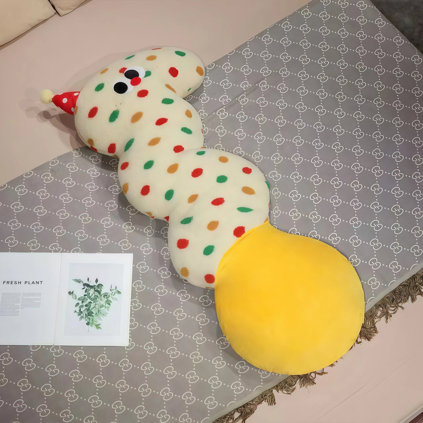Core keywords: body pillow, natural sleep aid, How to clean pillows?. An S-shaped plush body pillow for children (Specification: long cylindrical) with multi-colored polka dots on a plain white background, featuring a red conical party hat on the head and a large round yellow bottom. This cartoon pillow serves as a natural sleep aid and helps with how to help your baby fall asleep quickly. The detail page should guide users on how to clean pillows?