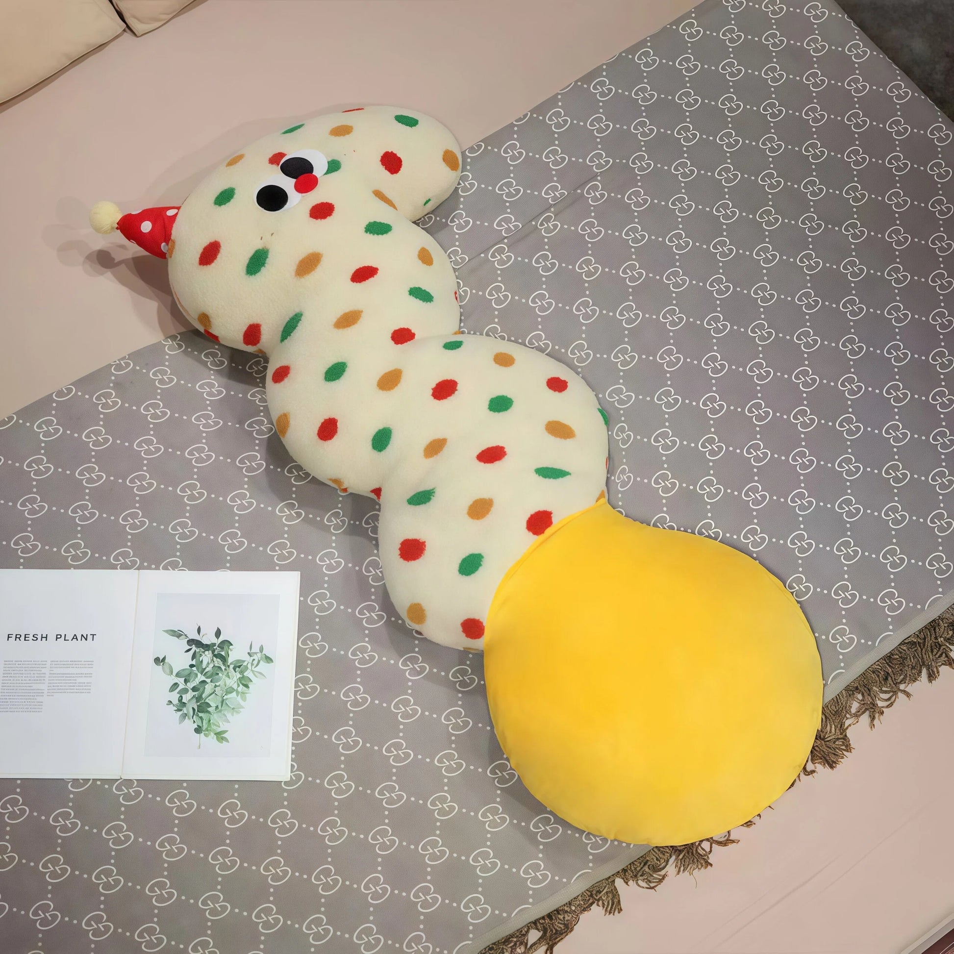 Core keywords: body pillow, natural sleep aid, How to clean pillows?. An S-shaped plush body pillow for children (Specification: long cylindrical) with multi-colored polka dots on a plain white background, featuring a red conical party hat on the head and a large round yellow bottom. This cartoon pillow serves as a natural sleep aid and helps with how to help your baby fall asleep quickly. The detail page should guide users on how to clean pillows?