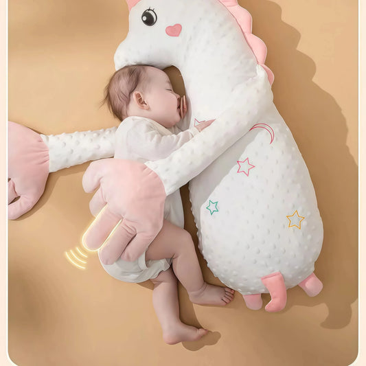 How mothers can quickly soothe their baby's emotions, Soothe your negative emotions. An infant with a pacifier is tightly embraced by a white unicorn parent-child plush pillow (Specification: side sleeping pillow). The large hand section of the pillow shows ripple marks, suggesting a soothing function like a sleep aid device. This is an effective stress relief toy for anxiety that can quickly soothe the baby's emotions, helping to soothe your negative emotions and warm your heart.