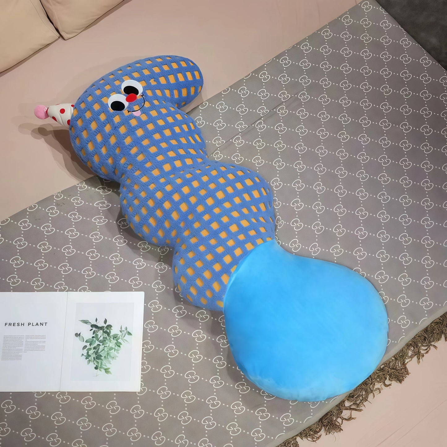 Core keywords: body pillow, natural sleep aid, How to clean pillows?. An S-shaped plush body pillow for children (Specification: long cylindrical) with multi-colored polka dots on a plain white background, featuring a red conical party hat on the head and a large round yellow bottom. This cartoon pillow serves as a natural sleep aid and helps with how to help your baby fall asleep quickly. The detail page should guide users on how to clean pillows?